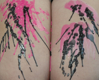 Black and Bright Pink dripping wax from candle and brushed wax from paint tin with safe burn temperature for intimate sensory use.